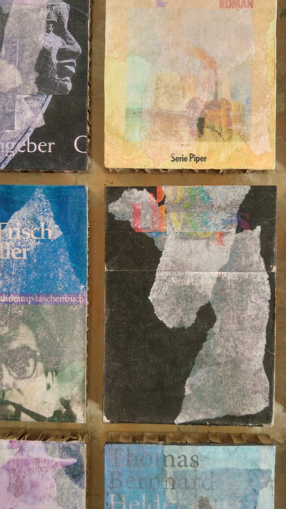 Detail of bandaged cover paintings pinned to the wall