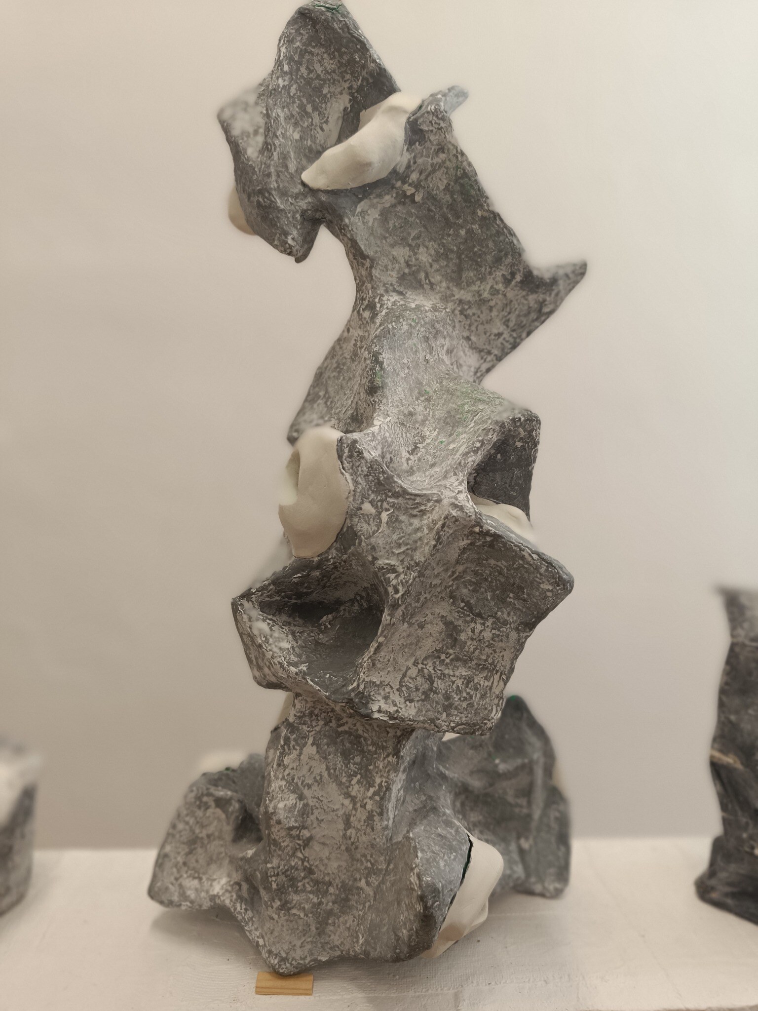 Vertical Hole Object with stacked openings and folded grey surfaces