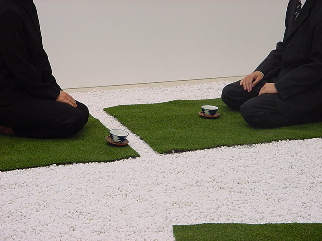 Tatami Landscape, two participants seated across white gravel