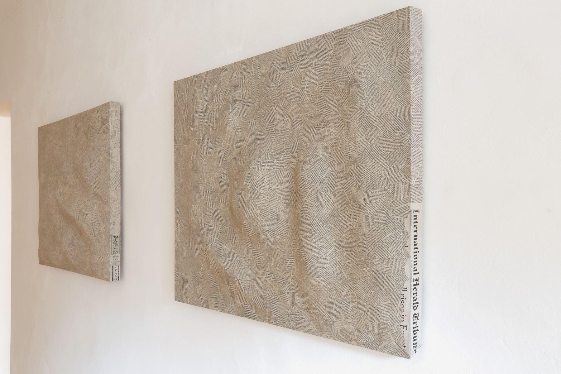 Textscapes presented horizontally on low metal supports